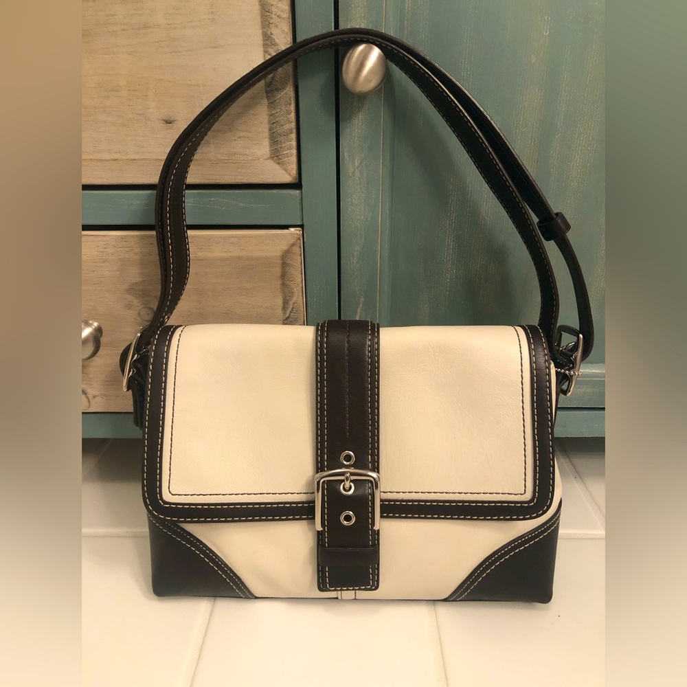 Coach leather purse. Ivory and dark brown with adjustable strap for crossbody.